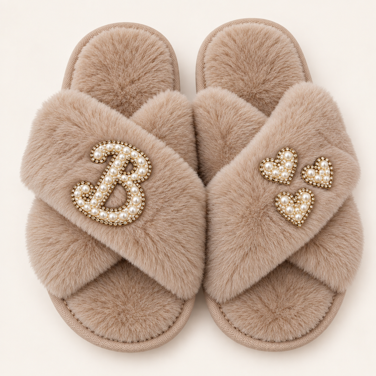 Beige faux fur crossover slippers with a pearl initial and three pearl hearts with gold-tone detailing, Grace & Grayson