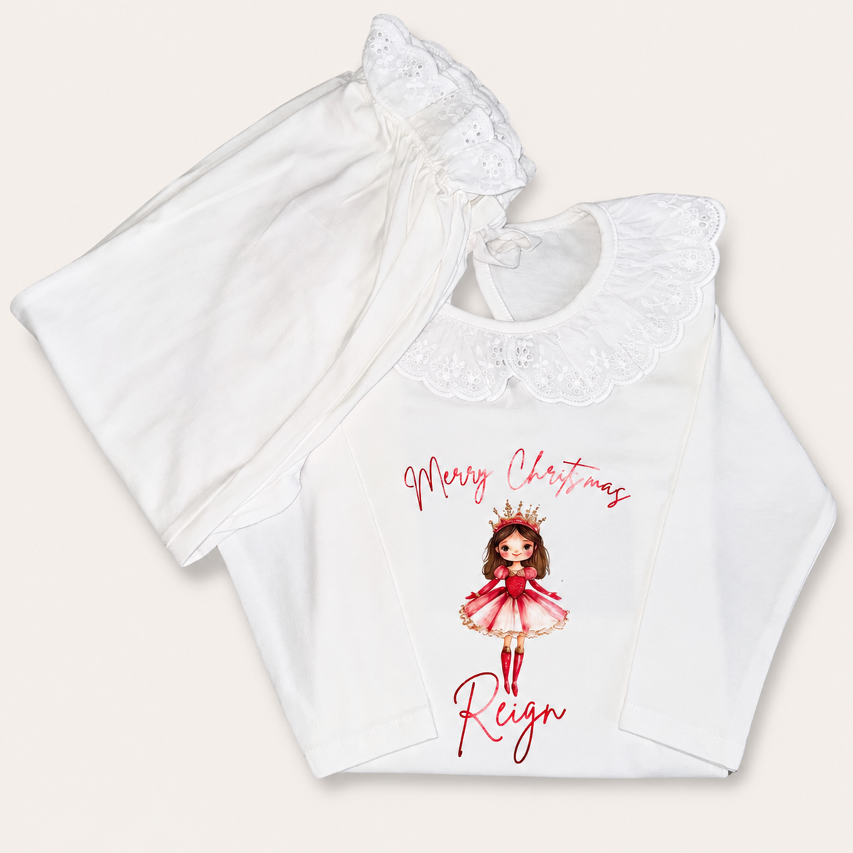 White personalised Sugar Plum Christmas frill pyjamas, displayed flat, Grace & Grayson