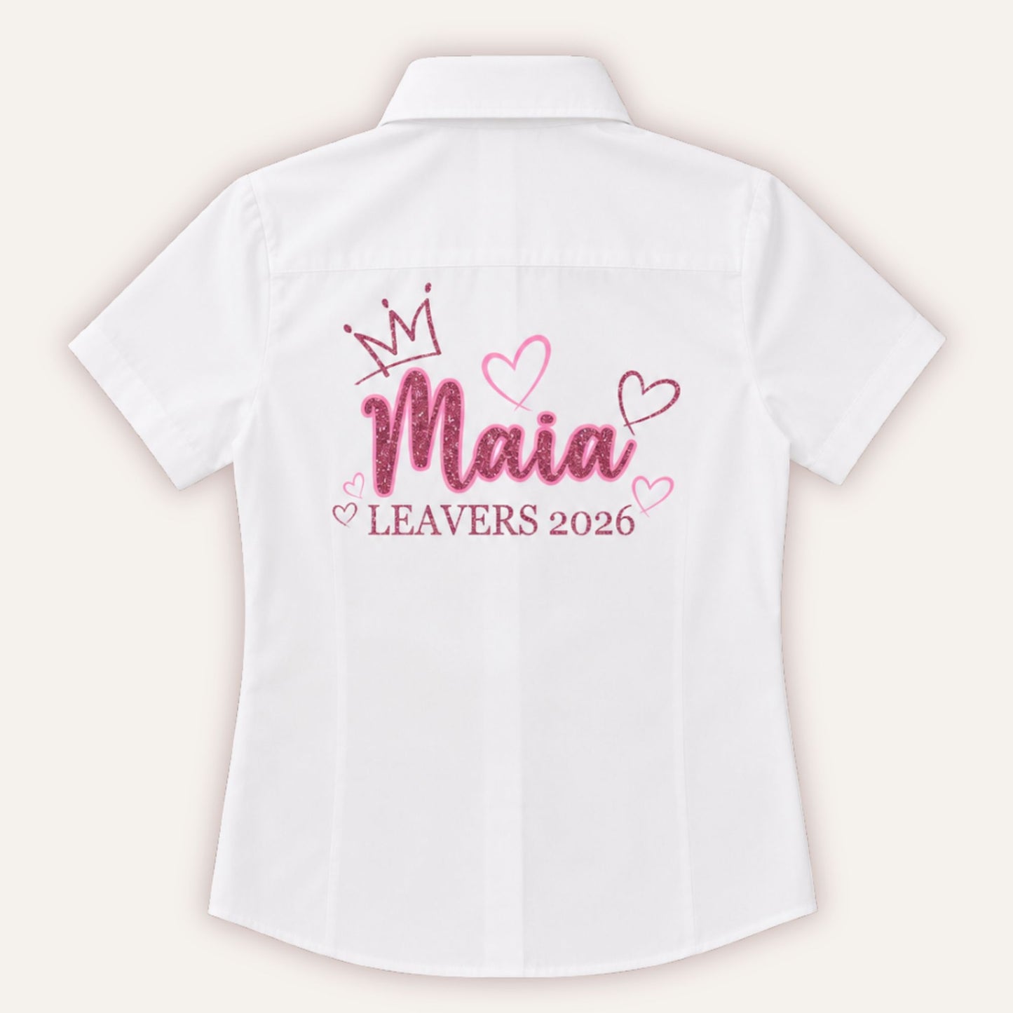 White personalised leavers shirt with glitter crown and hearts design in bubblegum pink and pink glitter, printed with a custom name and Leavers 2026