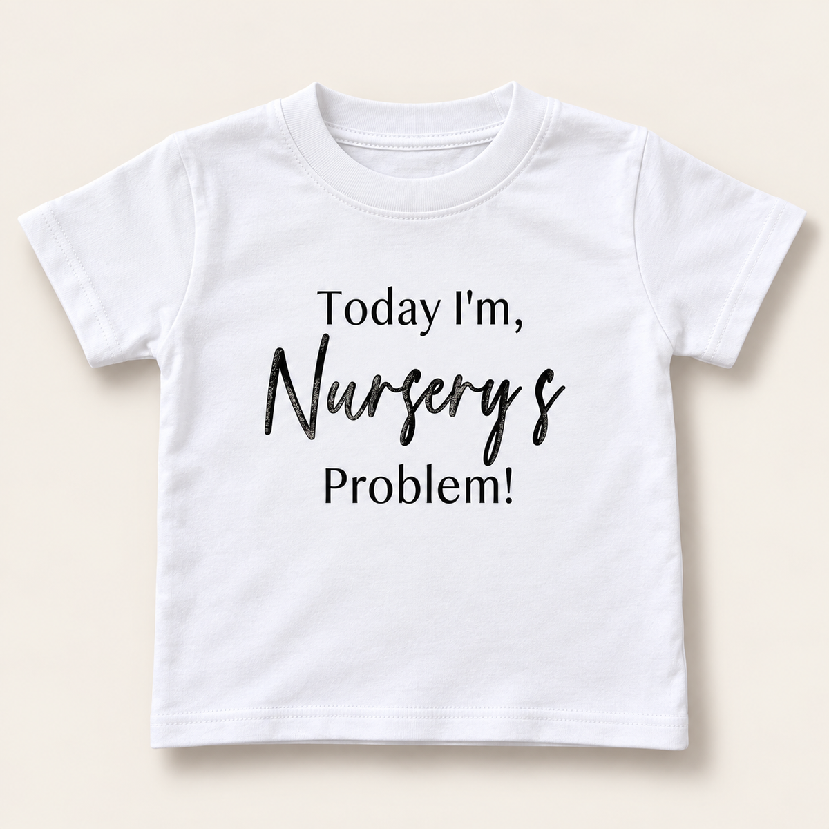 White children's personalised “Today I'm Nursery's Problem!” t-shirt displayed flat, Grace & Grayson.