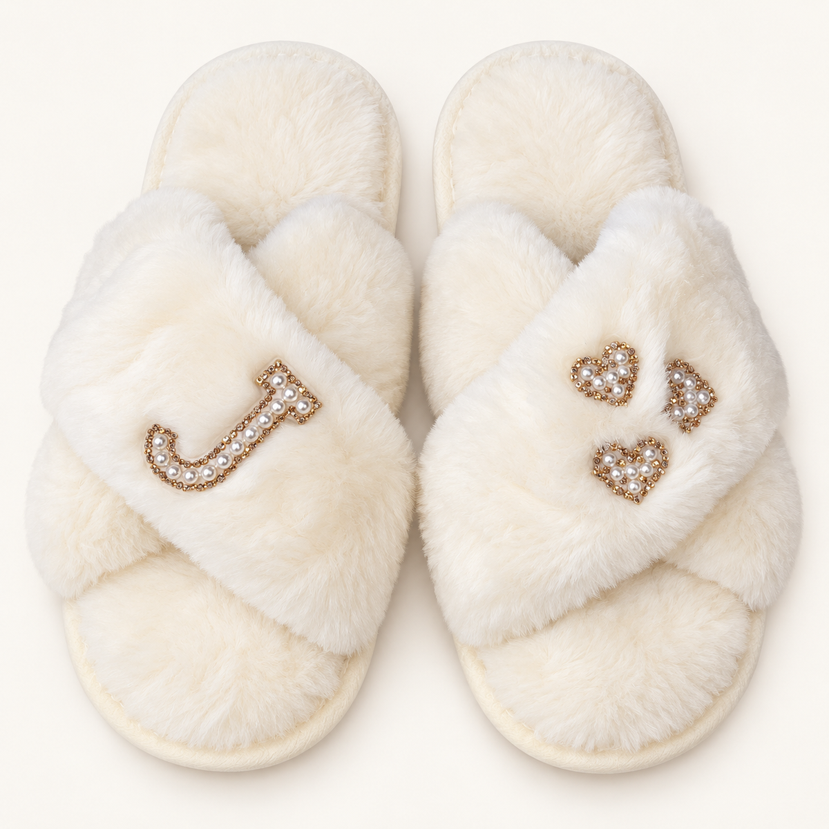 white faux fur crossover slippers with a pearl initial and three pearl hearts with gold-tone edging, Grace & Grayson.