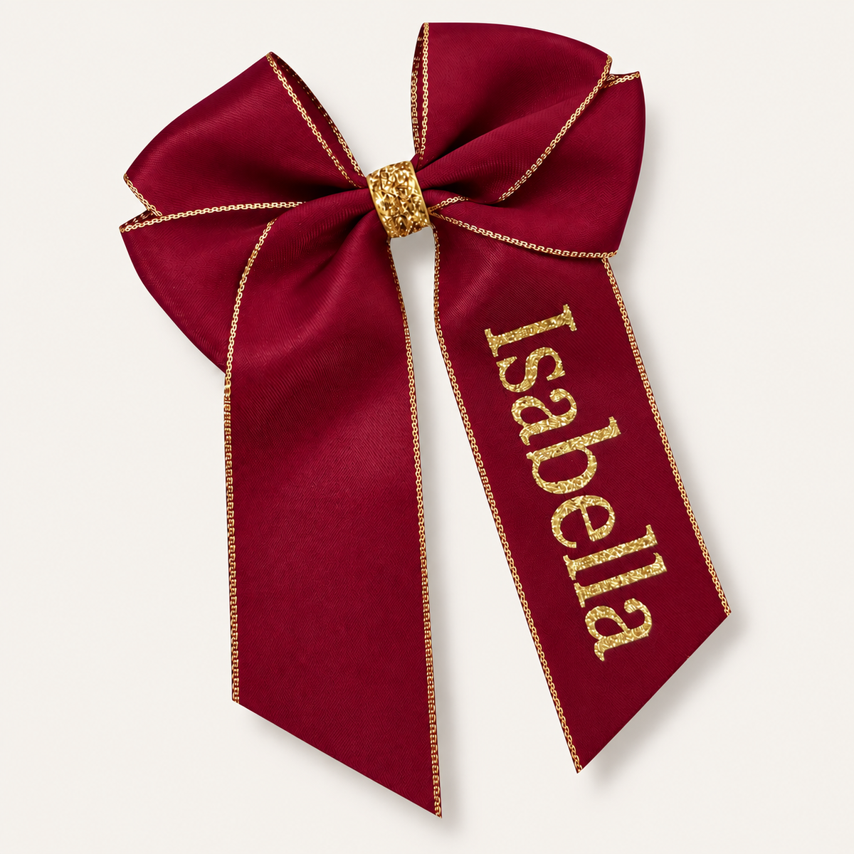 Burgundy satin hair bow with gold trim, a gold centre wrap and gold glitter lettering, Grace & Grayson.