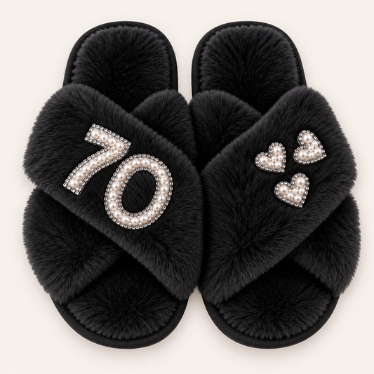 Black faux fur crossover slippers with a pearl number 70, silver trim and three pearl hearts, Grace & Grayson