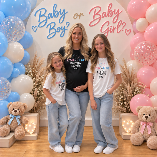 Adult and two girls modelling matching Pink or Blue gender reveal t-shirts with “Mummy Loves You” and “Sister Loves You” designs, surrounded by pink and blue balloons, Grace & Grayson.