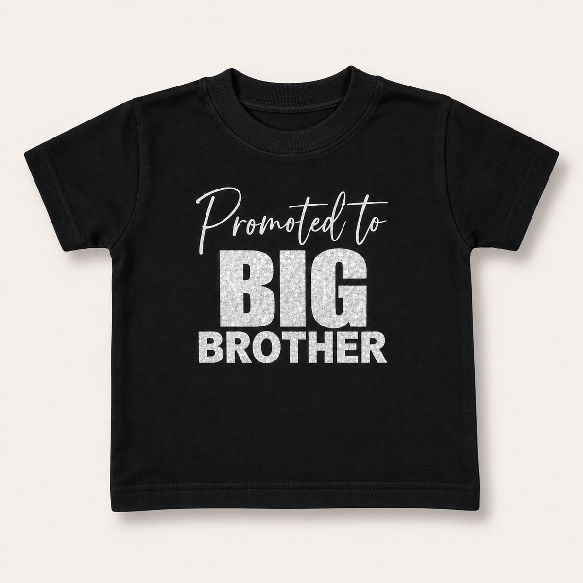 Black children's “Promoted to Big Brother” t-shirt with silver lettering, Grace & Grayson.