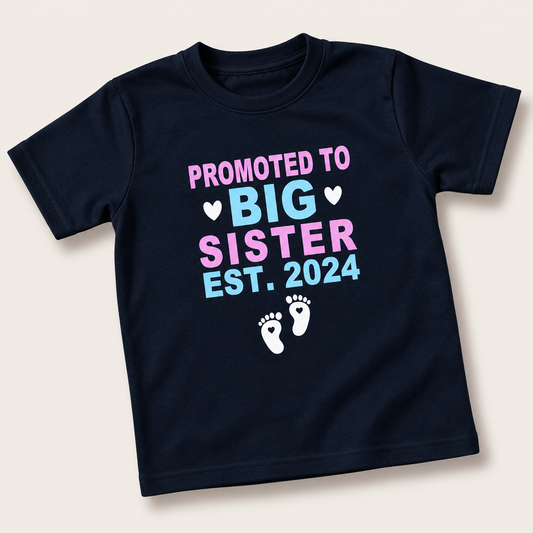 Black children's t-shirt reading “Promoted to Big Sister” with pink and blue lettering, EST. 2024 and footprint design, Grace & Grayson.