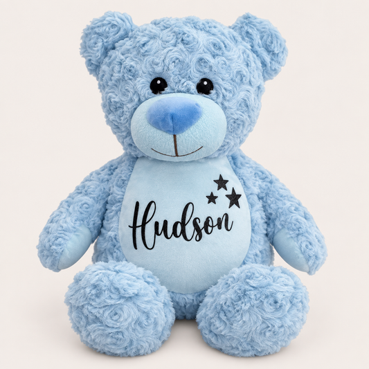 Blue personalised teddy bear with name lettering and three black star details on the tummy, Grace & Grayson
