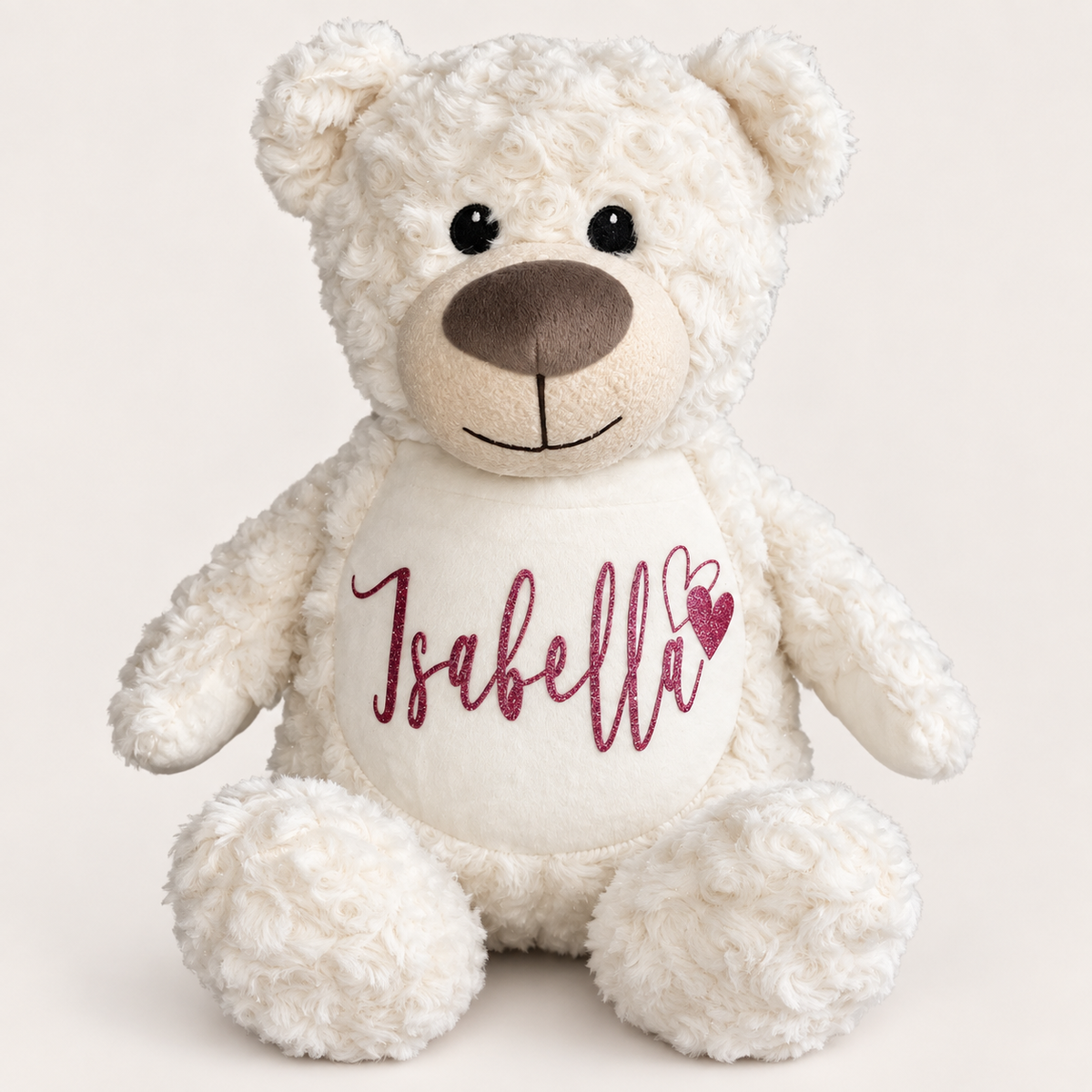 Cream personalised teddy bear with heart detail and pink name lettering on the tummy, Grace & Grayson
