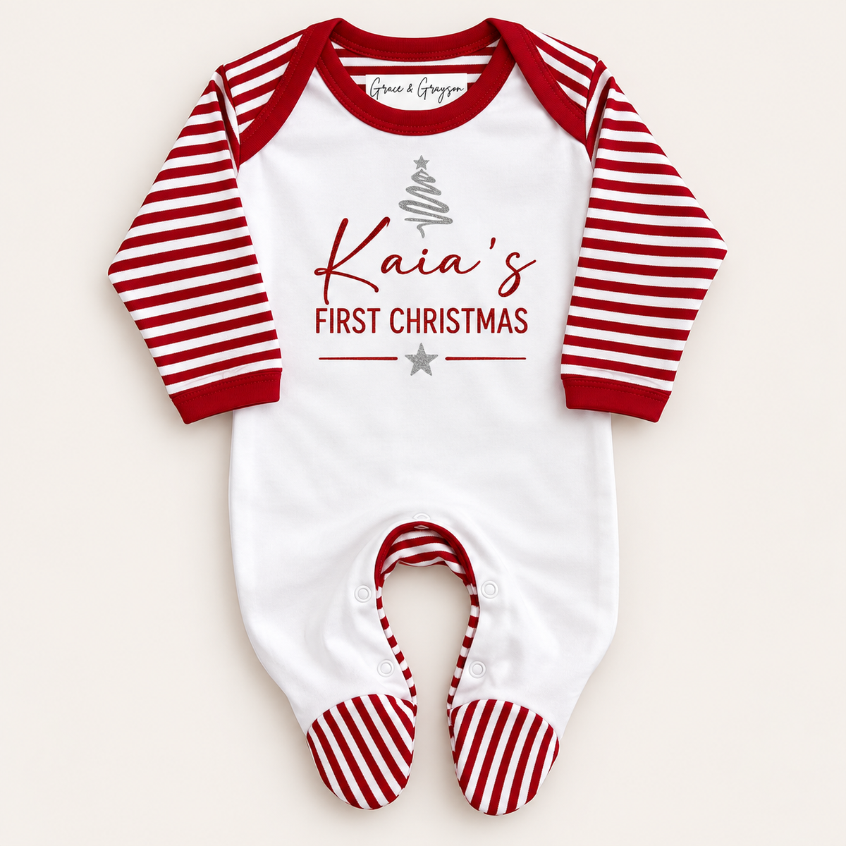 Personalised First Christmas red and white stripe footed baby grow with a silver Christmas tree design, Grace & Grayson