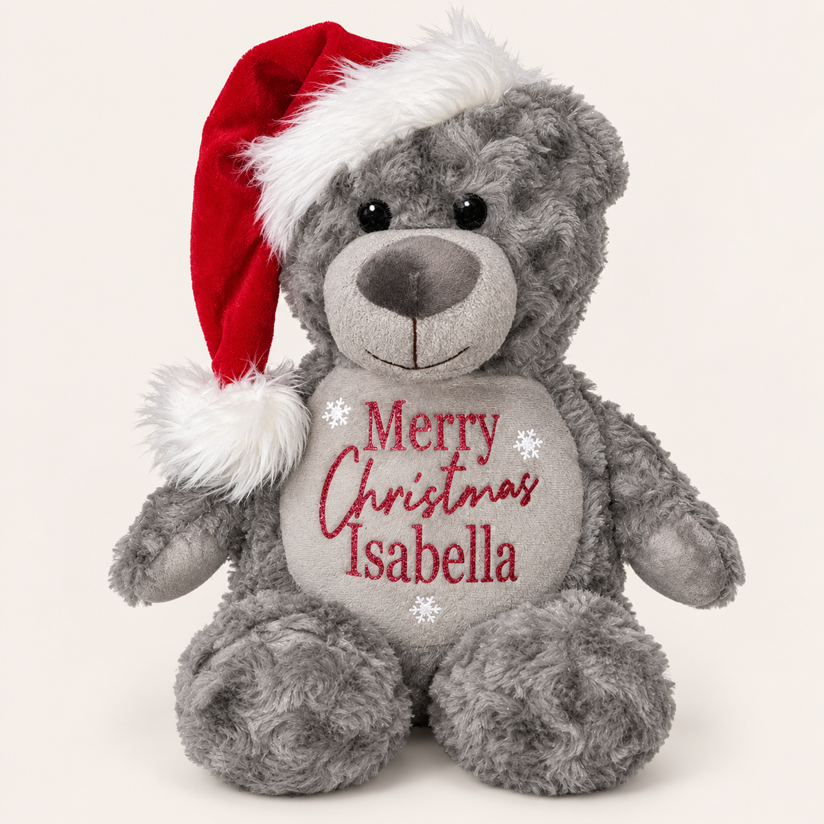Grey personalised Christmas teddy bear wearing a Santa hat with red Merry Christmas lettering, displayed on a light background, Grace & Grayson