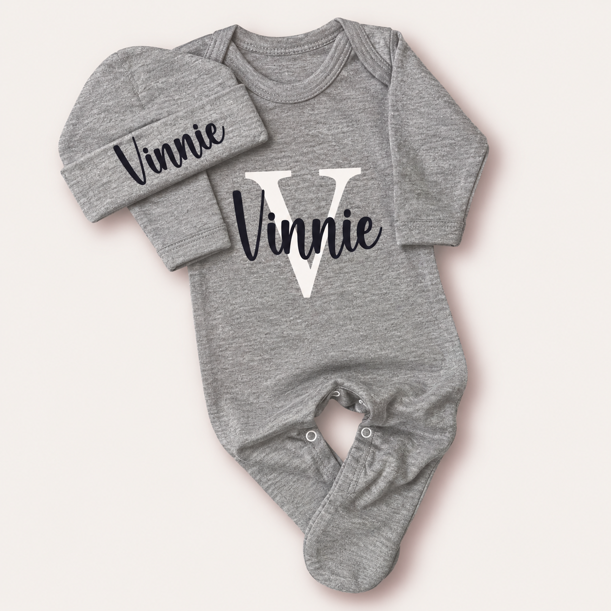 Grey personalised baby grow and matching hat with a white initial design, Grace & Grayson
