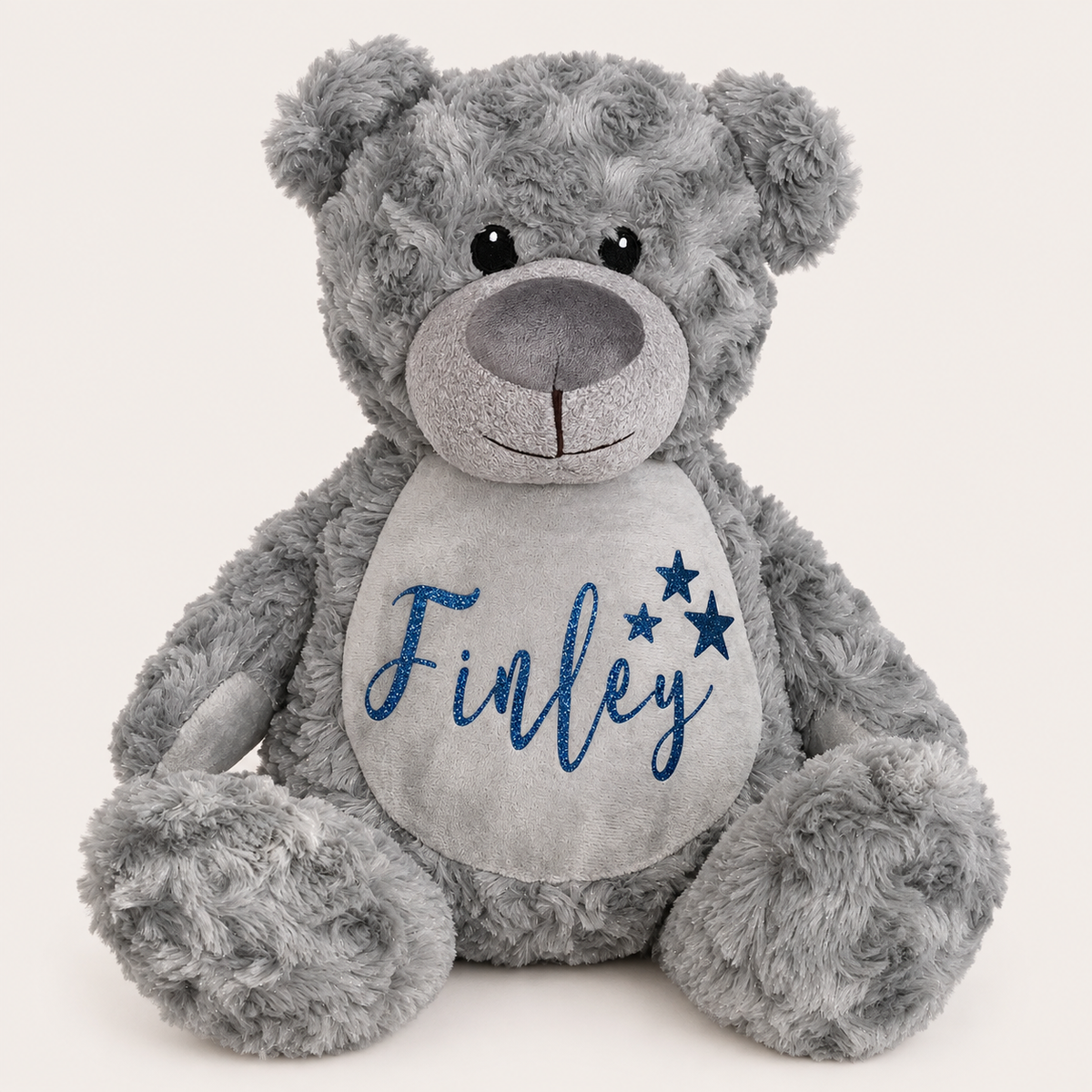Grey personalised teddy bear with blue name lettering and three blue star details on the tummy, Grace & Grayson