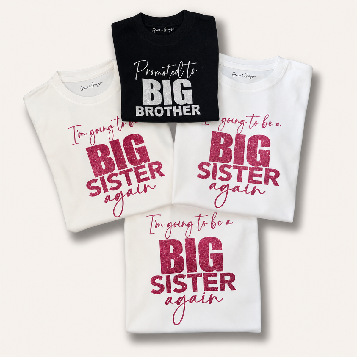Matching black big brother and white big sister again announcement t-shirts displayed together, Grace & Grayson.