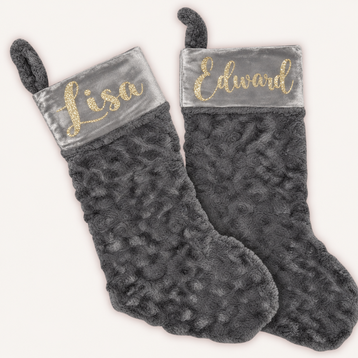 Pair of grey plush Christmas stockings with grey cuffs and gold glitter personalised lettering, Grace & Grayson.
