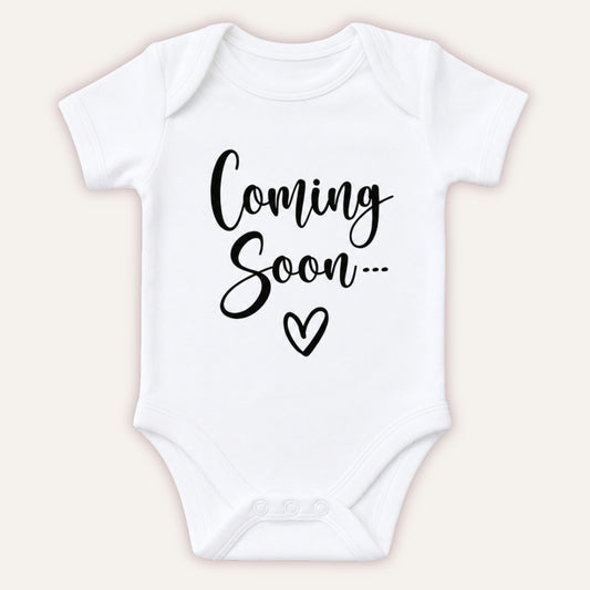 Personalised Coming Soon baby announcement vest with black Coming Soon script and heart design on white bodysuit - Grace & Grayson