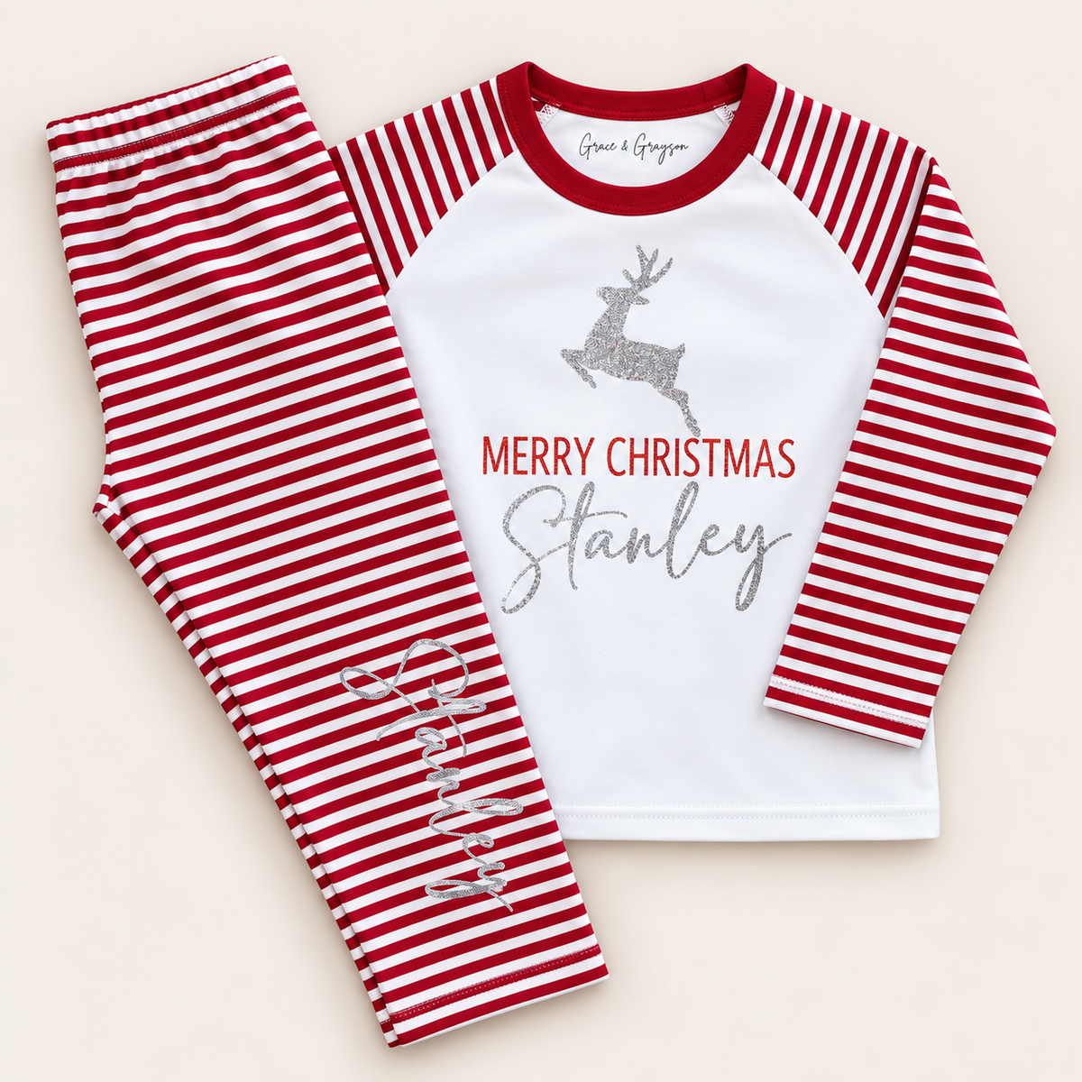 Personalised Merry Christmas red and white stripe children’s pyjamas with a star Christmas tree design, Grace & Grayson