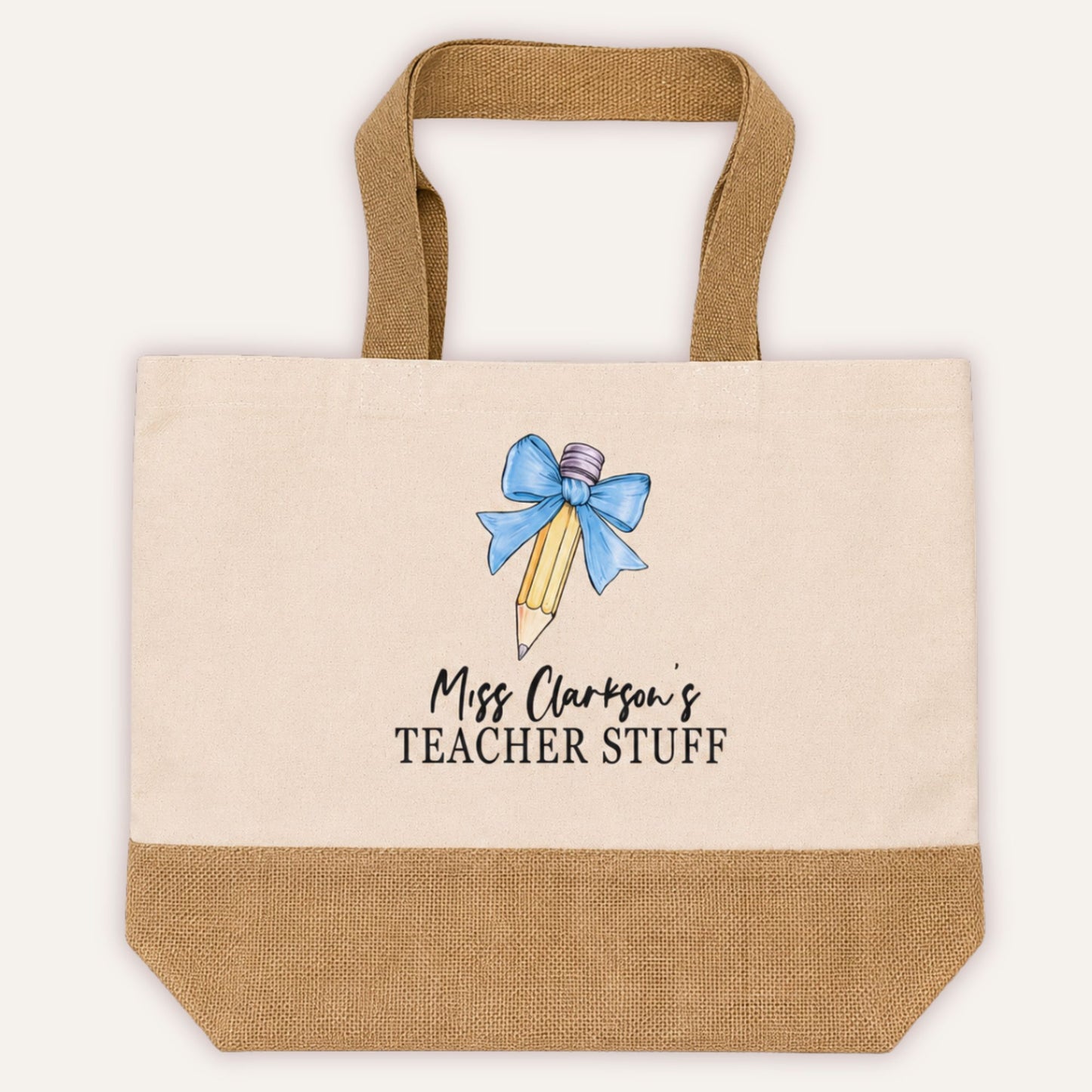 Personalised Teacher Stuff jute tote bag with bow and pencil design in light blue, custom teacher name in script font on cream canvas with jute base | Grace & Grayson