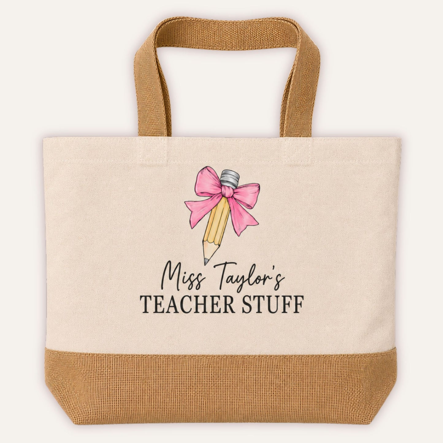 Personalised Teacher Stuff jute tote bag with bow and pencil design in pink, custom teacher name in script font on cream canvas with jute base | Grace & Grayson
