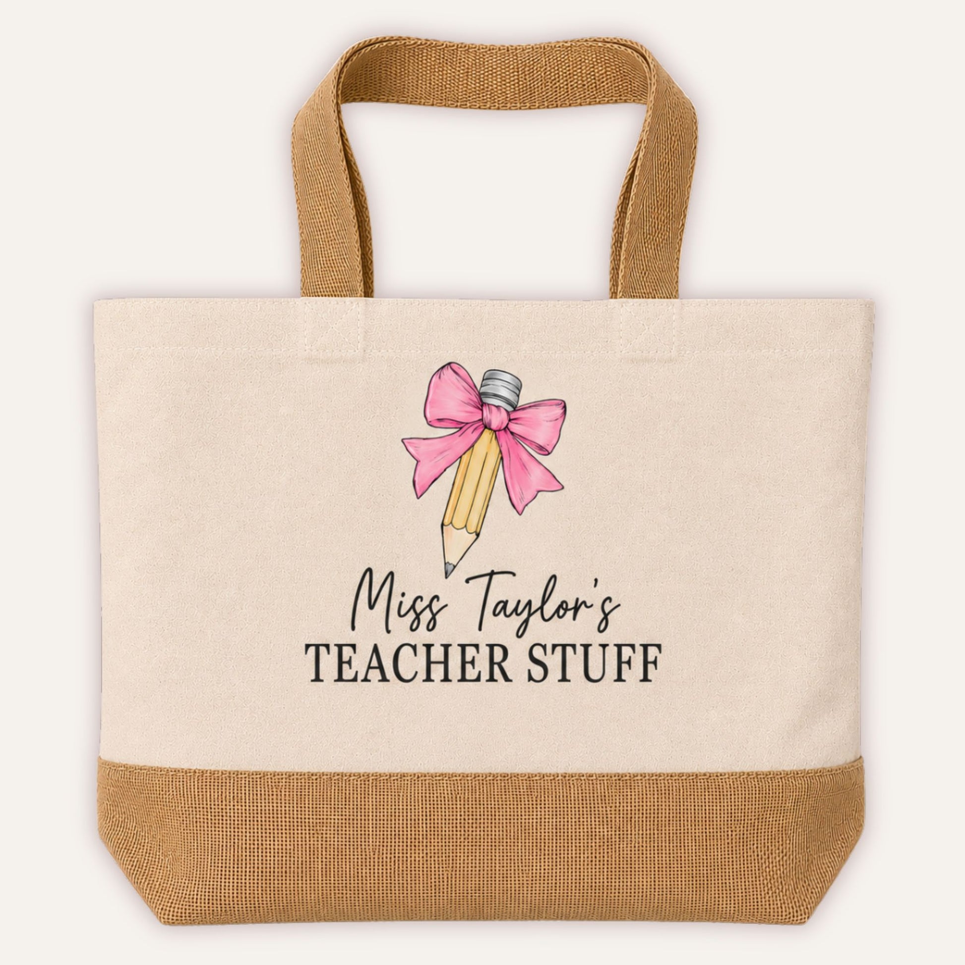 Personalised Teacher Stuff jute tote bag with bow and pencil design in pink, custom teacher name in script font on cream canvas with jute base | Grace & Grayson
