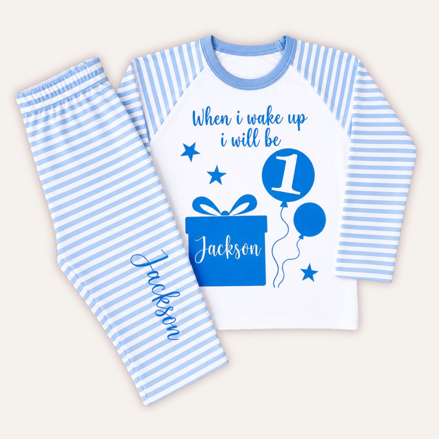 Personalised boys blue striped birthday pyjamas with birthday gift and balloon design, featuring age number and custom name.