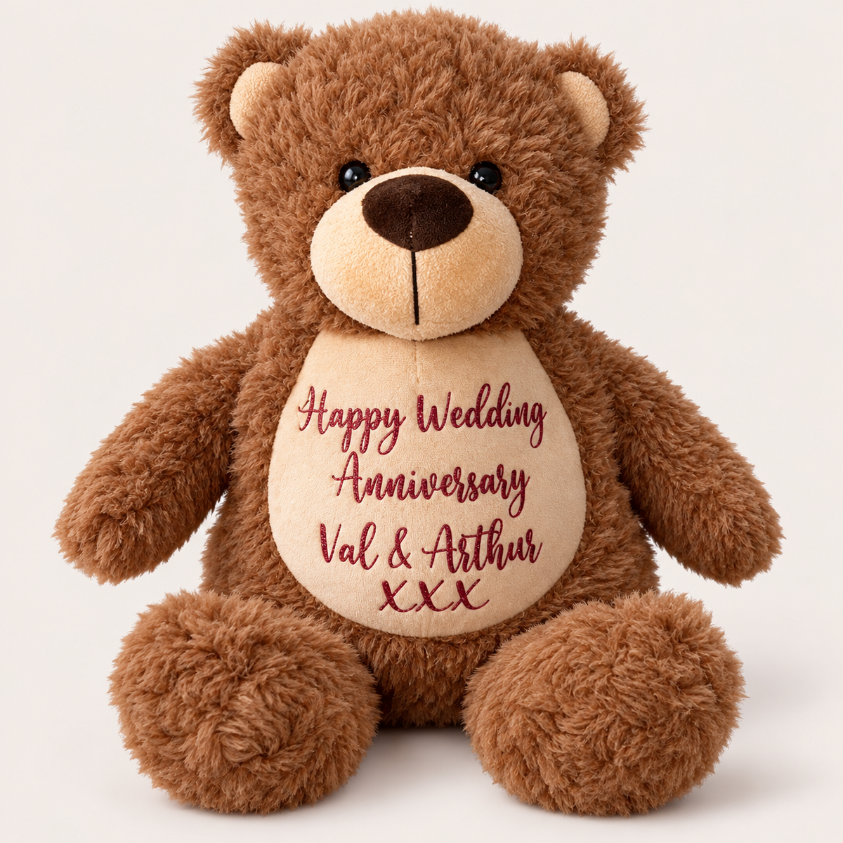Personalised brown teddy bear with a red Happy Wedding Anniversary message on its cream tummy, Grace & Grayson