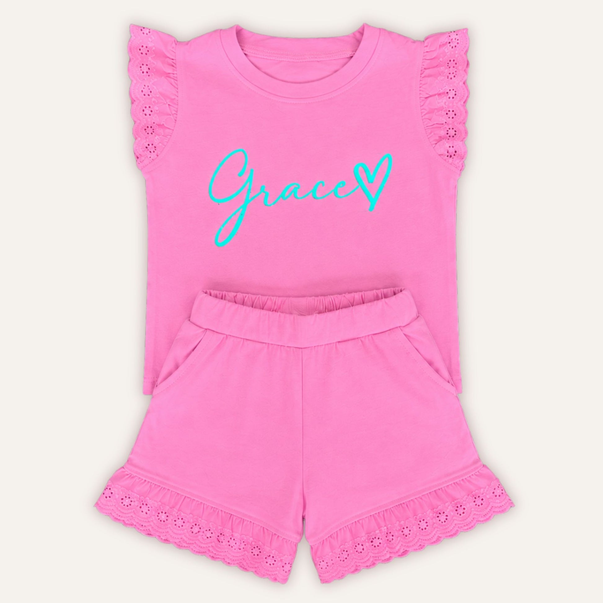 Personalised heart frill set with custom name, worn by Grace – Grace & Grayson