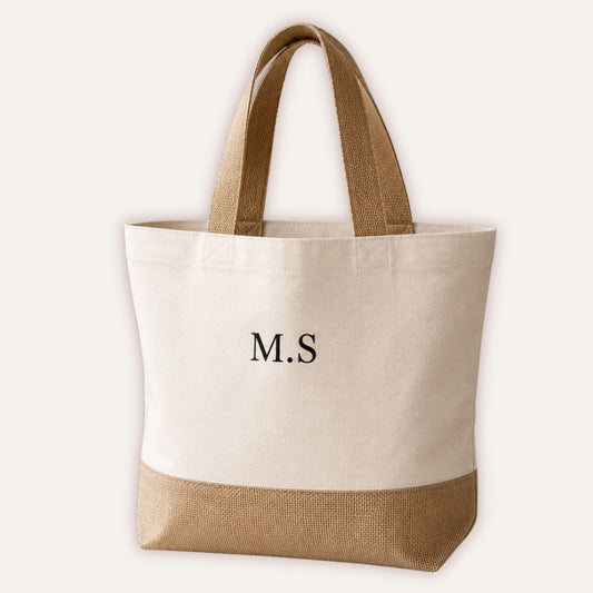 Personalised initials jute tote bag with custom monogram in classic serif font on cream canvas with natural jute base and handles | Grace & Grayson
