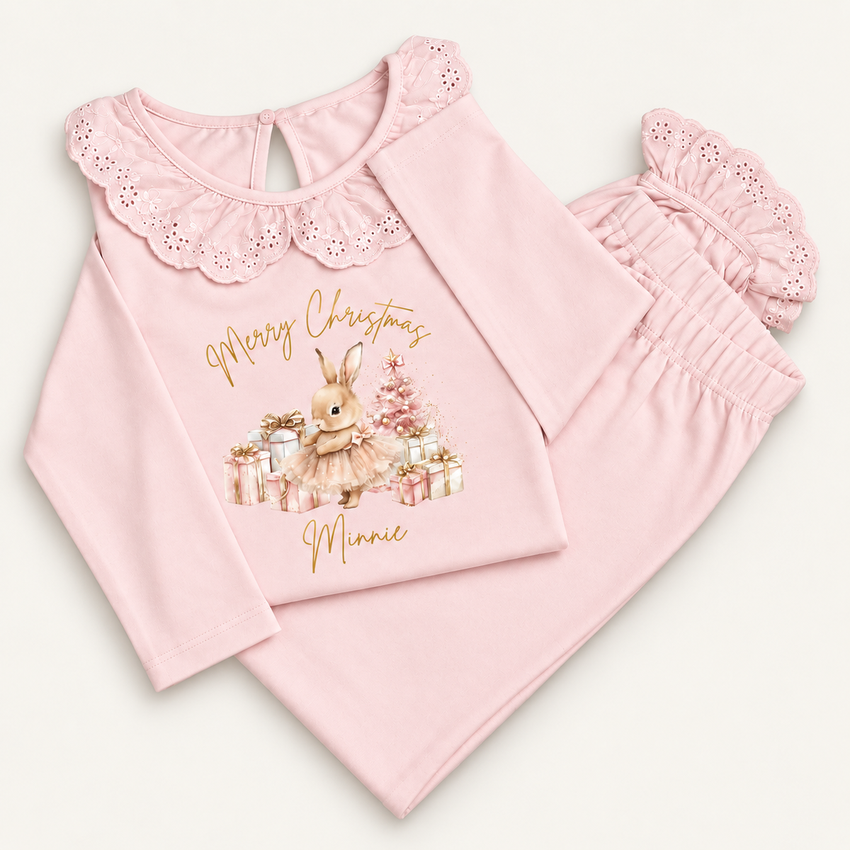 Personalised pink Christmas frill pyjamas featuring a Christmas bunny design by Grace & Grayson