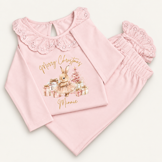 Personalised pink Christmas frill pyjamas featuring a Christmas bunny design by Grace & Grayson