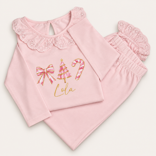 Personalised pink Christmas frill pyjamas with bow, Christmas tree and candy cane design by Grace & Grayson