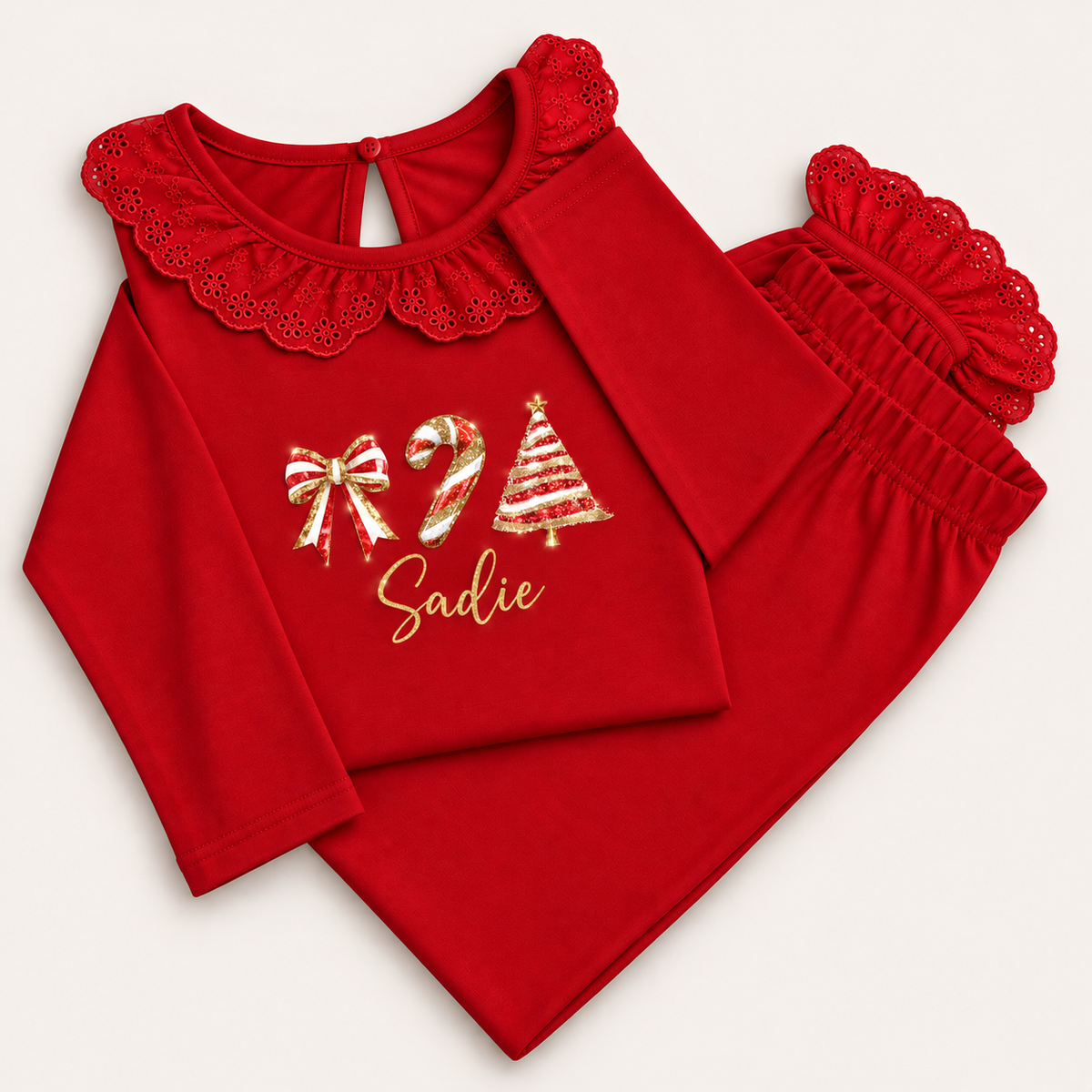 Personalised red Christmas frill pyjamas with bow, Christmas tree and candy cane design by Grace & Grayson
