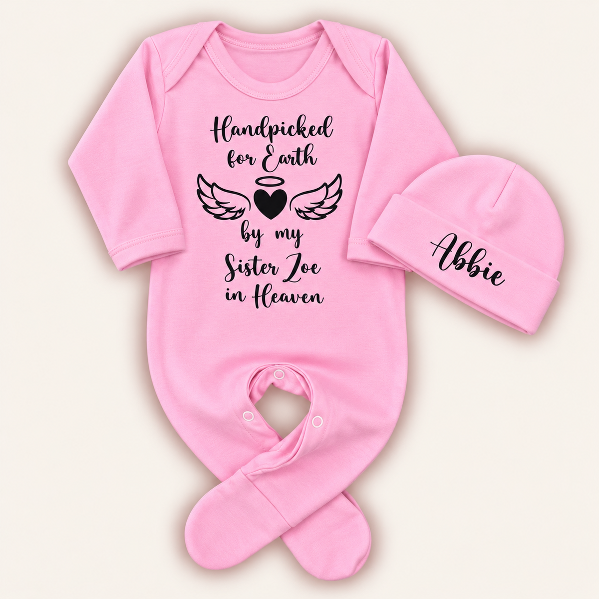 Pink personalised Handpicked For Earth baby grow and matching hat with black angel wings and heart memorial design
