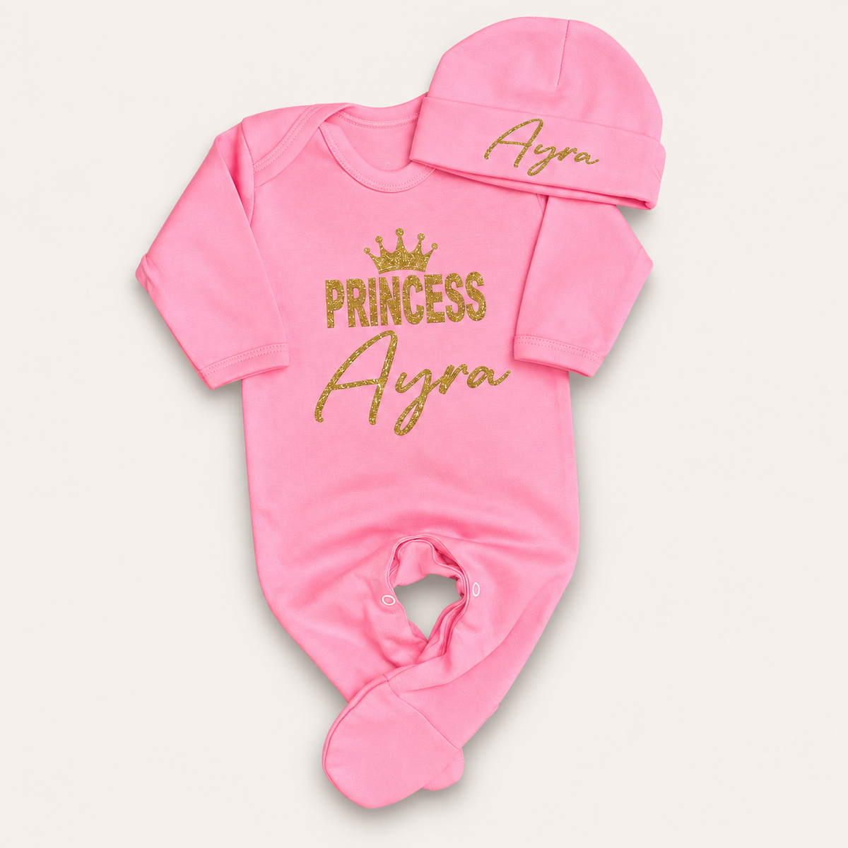 Pink personalised Princess baby grow and matching hat with gold glitter crown lettering, Grace & Grayson