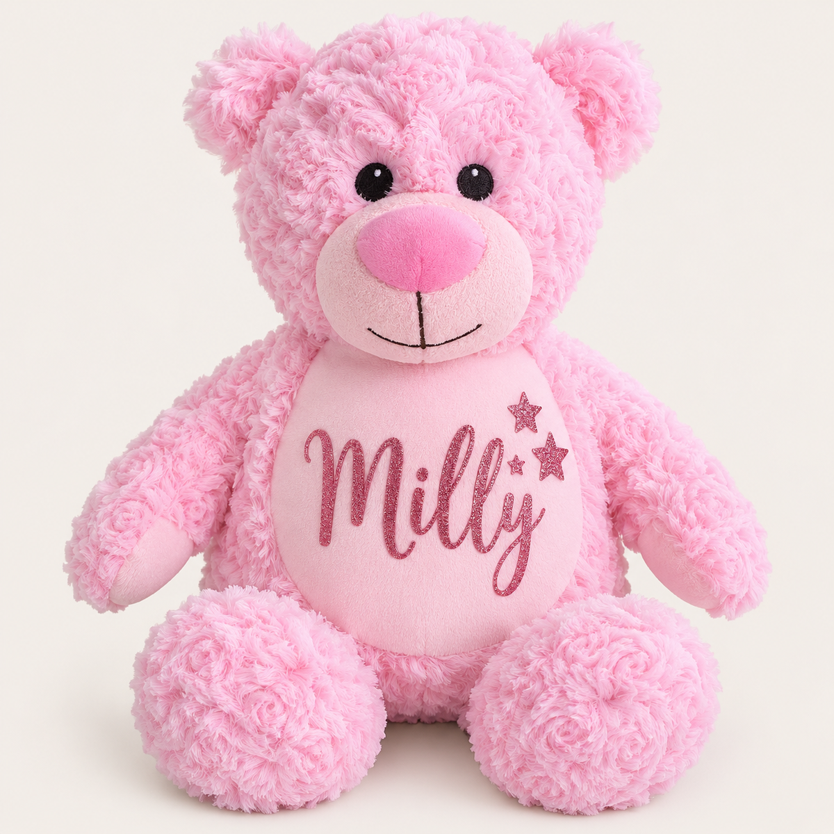 Pink personalised teddy bear with pink name lettering and three glitter star details on the tummy, Grace & Grayson