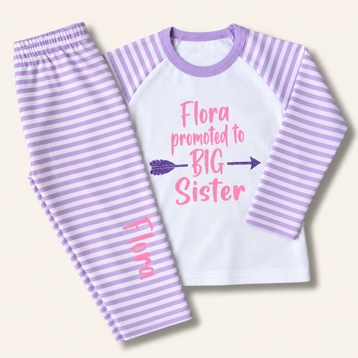Purple and white striped personalised children’s pyjamas with a “Promoted to Big Sister” design, displayed flat, Grace & Grayson.