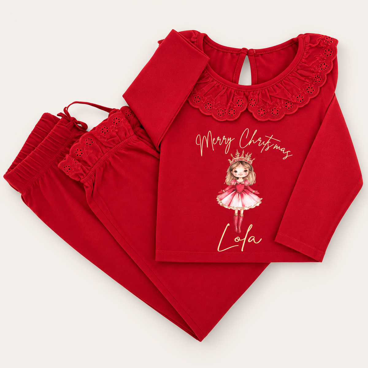 Red personalised Sugar Plum Christmas frill pyjamas with a frill collar and festive fairy design, displayed flat, Grace & Grayson