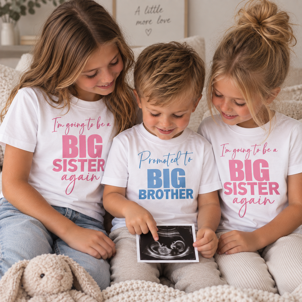 Three children wearing personalised big brother and big sister again announcement t-shirts, holding an ultrasound photo, Grace & Grayson.