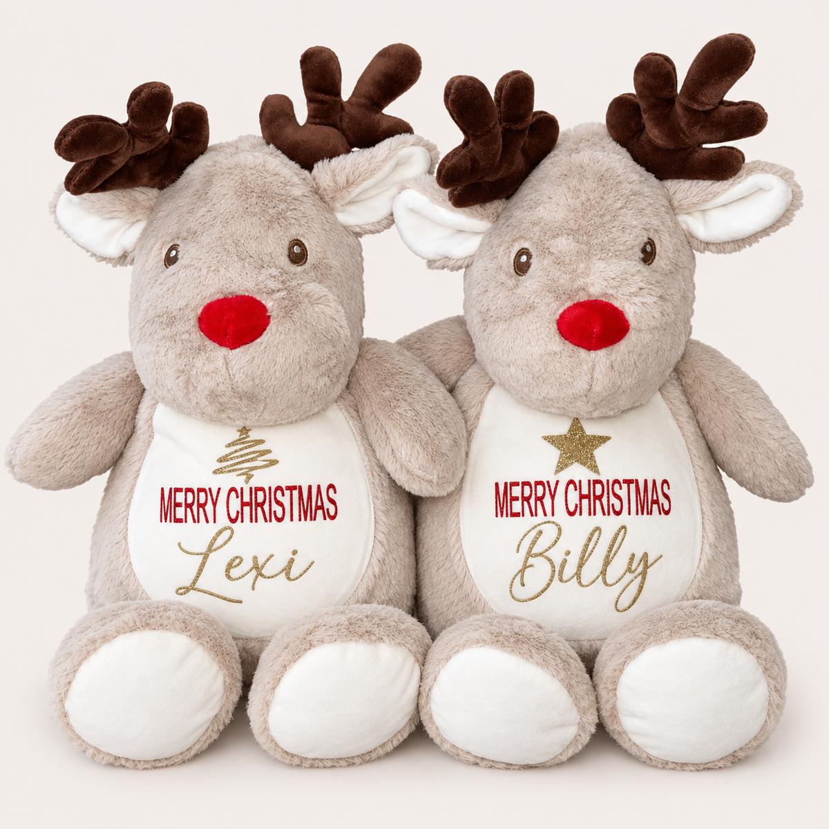 Two light brown reindeer Christmas teddies together with different gold Christmas chest designs, one featuring a Christmas tree and one a star, Grace & Grayson