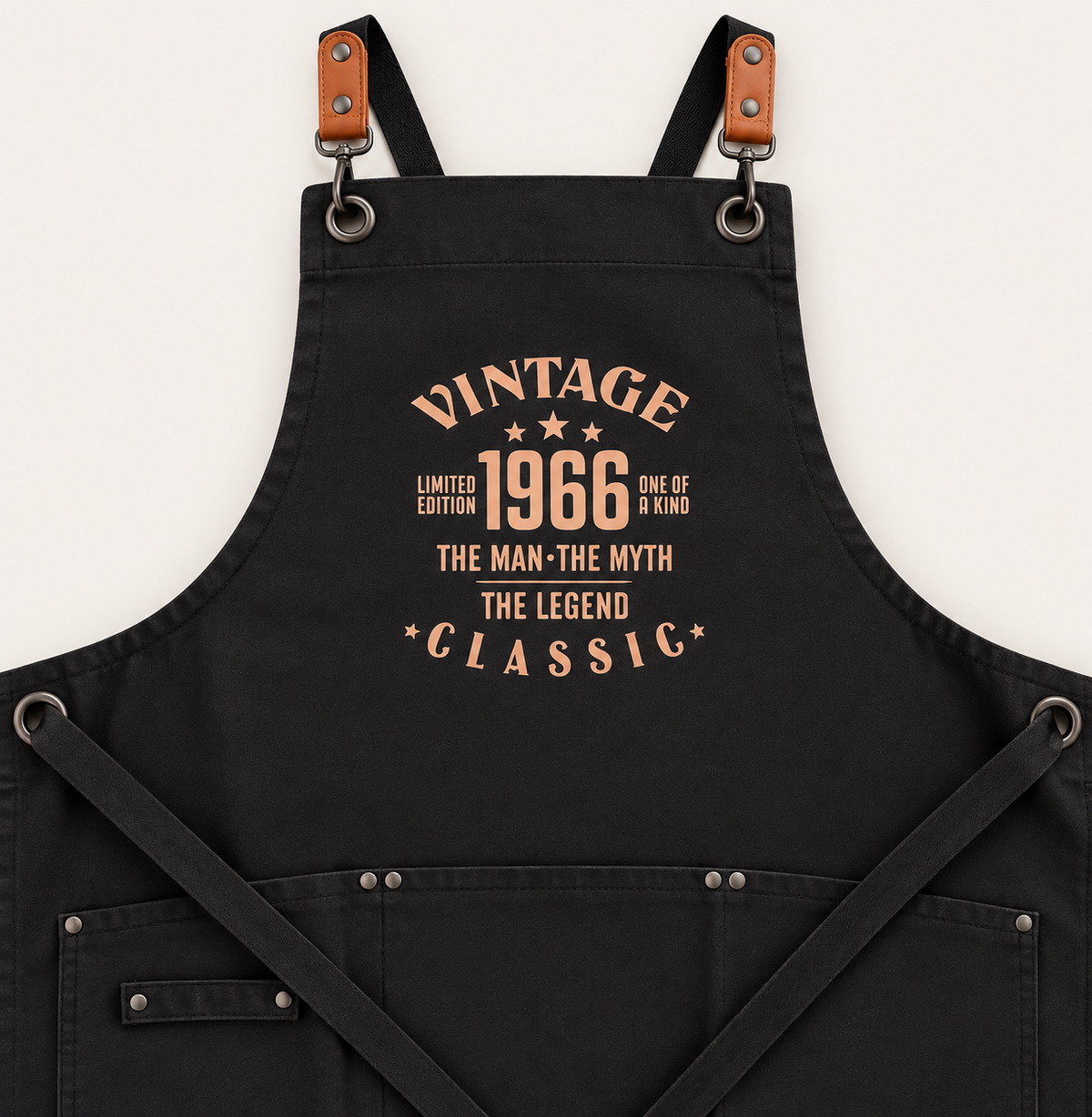 Close-up of black adult apron showing the Vintage 1966 The Man, The Myth, The Legend Classic design, Grace & Grayson