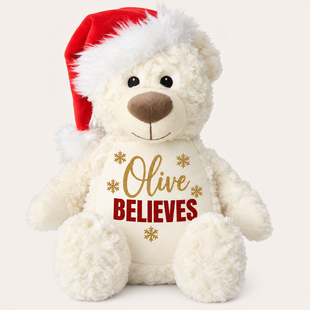 White personalised Believes Christmas teddy wearing a Santa hat with gold name lettering and snowflake details, Grace & Grayson