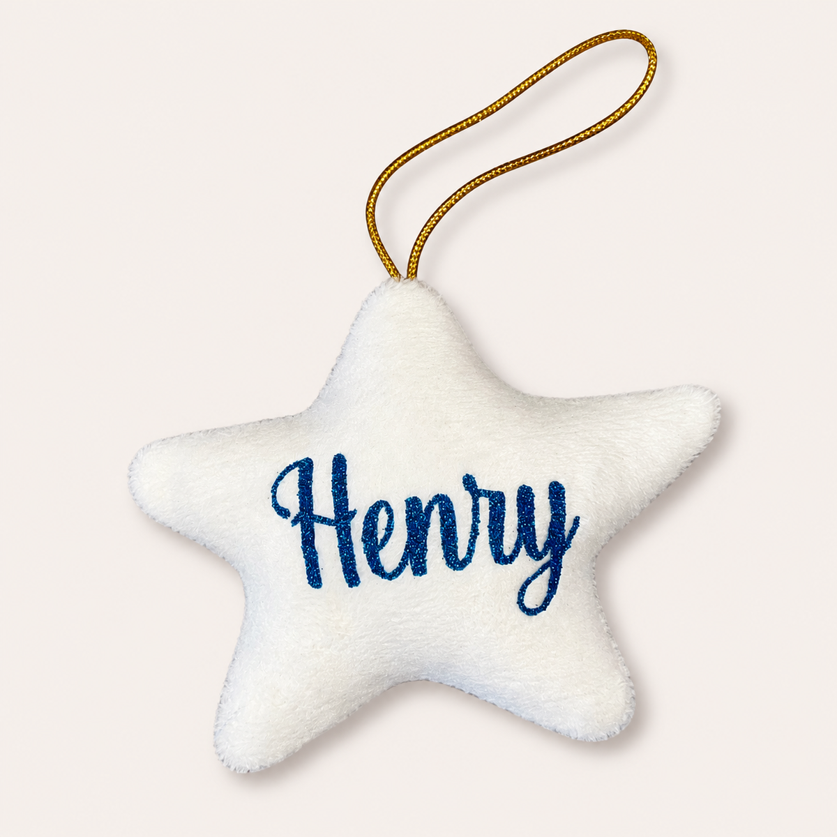 White personalised Christmas star tree decoration with blue glitter lettering, displayed on a light background, Grace & Grayson
