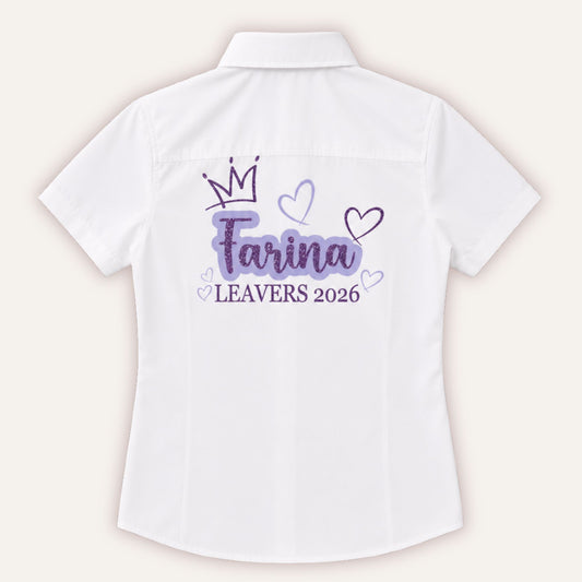 White personalised leavers shirt with glitter crown and hearts design in lilac and purple, printed with a custom name and Leavers 2026
