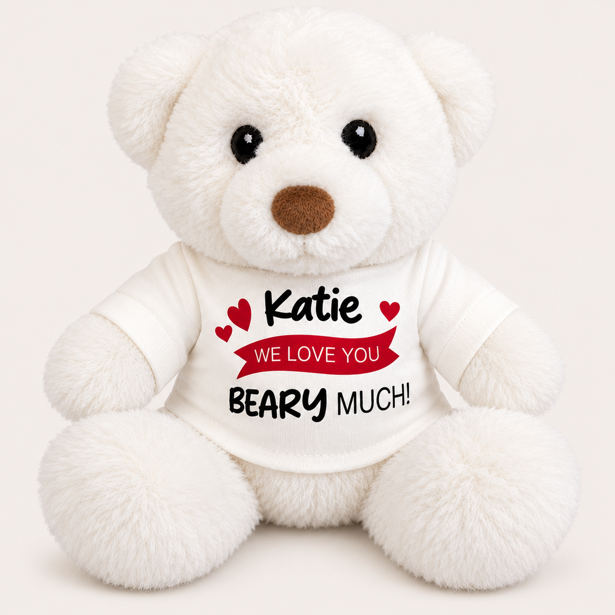 White personalised teddy bear wearing a white t-shirt with red heart details and a “We Love You Beary Much” message, Grace & Grayson