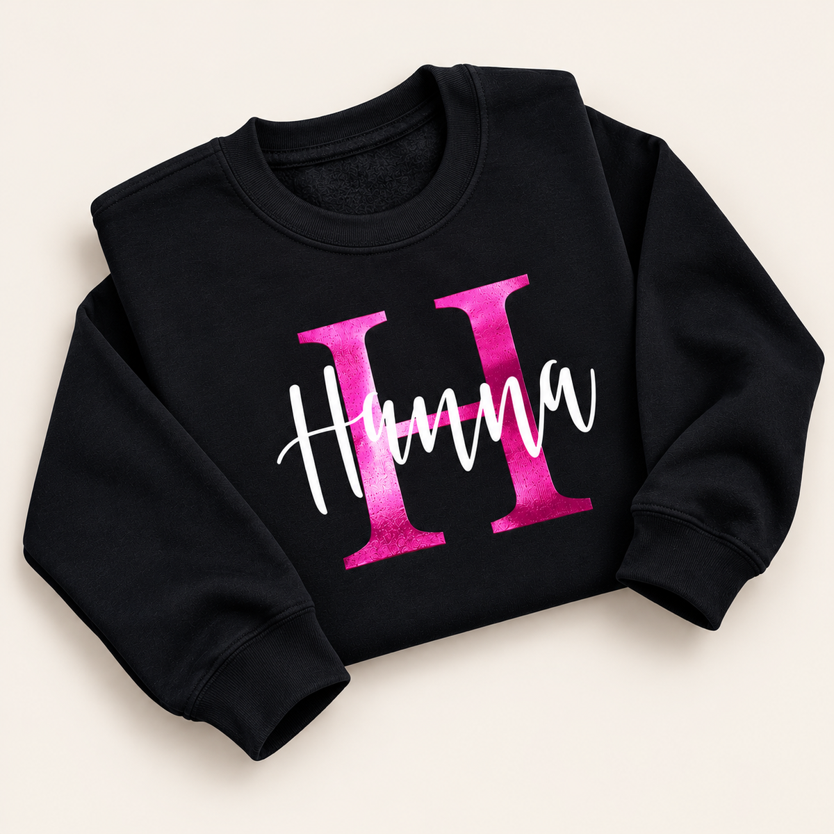 Black personalised sweatshirt with a pink pearl initial and white script name | Grace & Grayson