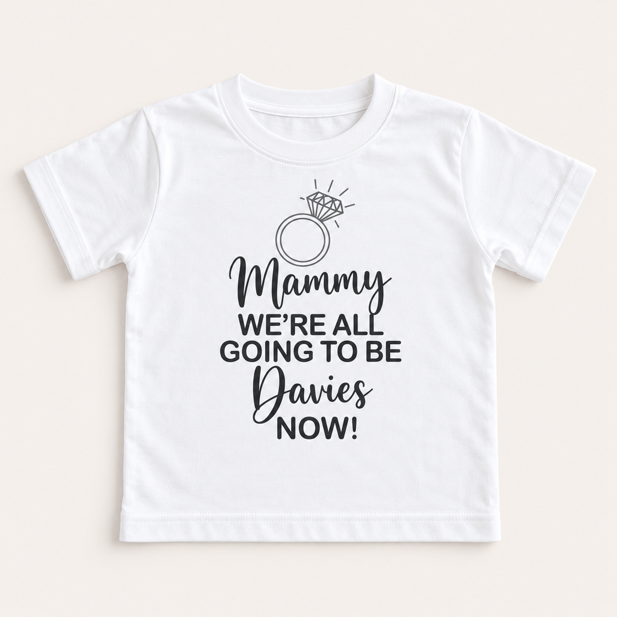 Front-facing white children’s personalised proposal T-shirt with a ring illustration and family proposal wording, Grace & Grayson