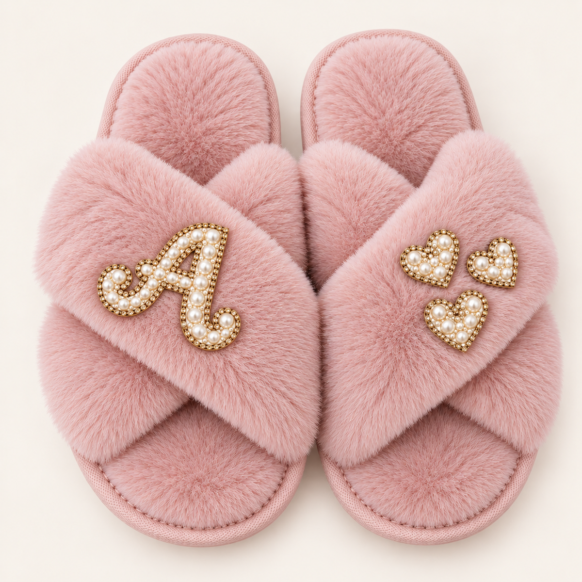 Pink faux fur crossover slippers with a pearl initial and three pearl hearts with gold-tone detailing, Grace & Grayson