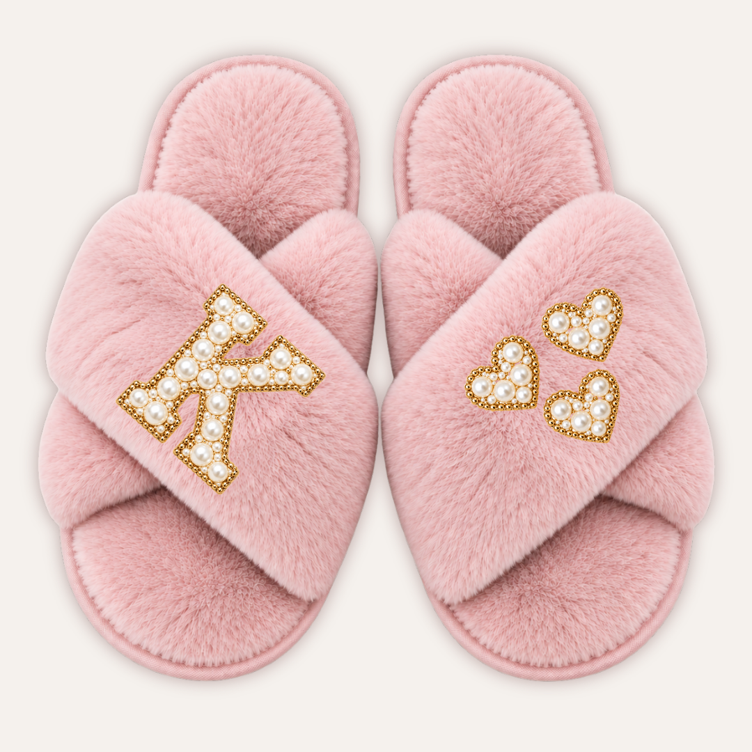 Pink faux fur crossover slippers with a pearl initial and three pearl hearts with gold-tone edging, Grace & Grayson.