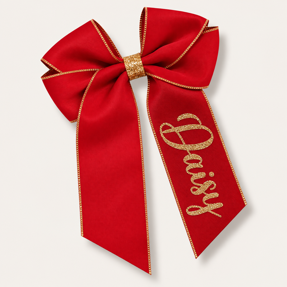 Red satin hair bow with gold trim, a gold centre wrap and gold glitter lettering, Grace & Grayson. ⠋