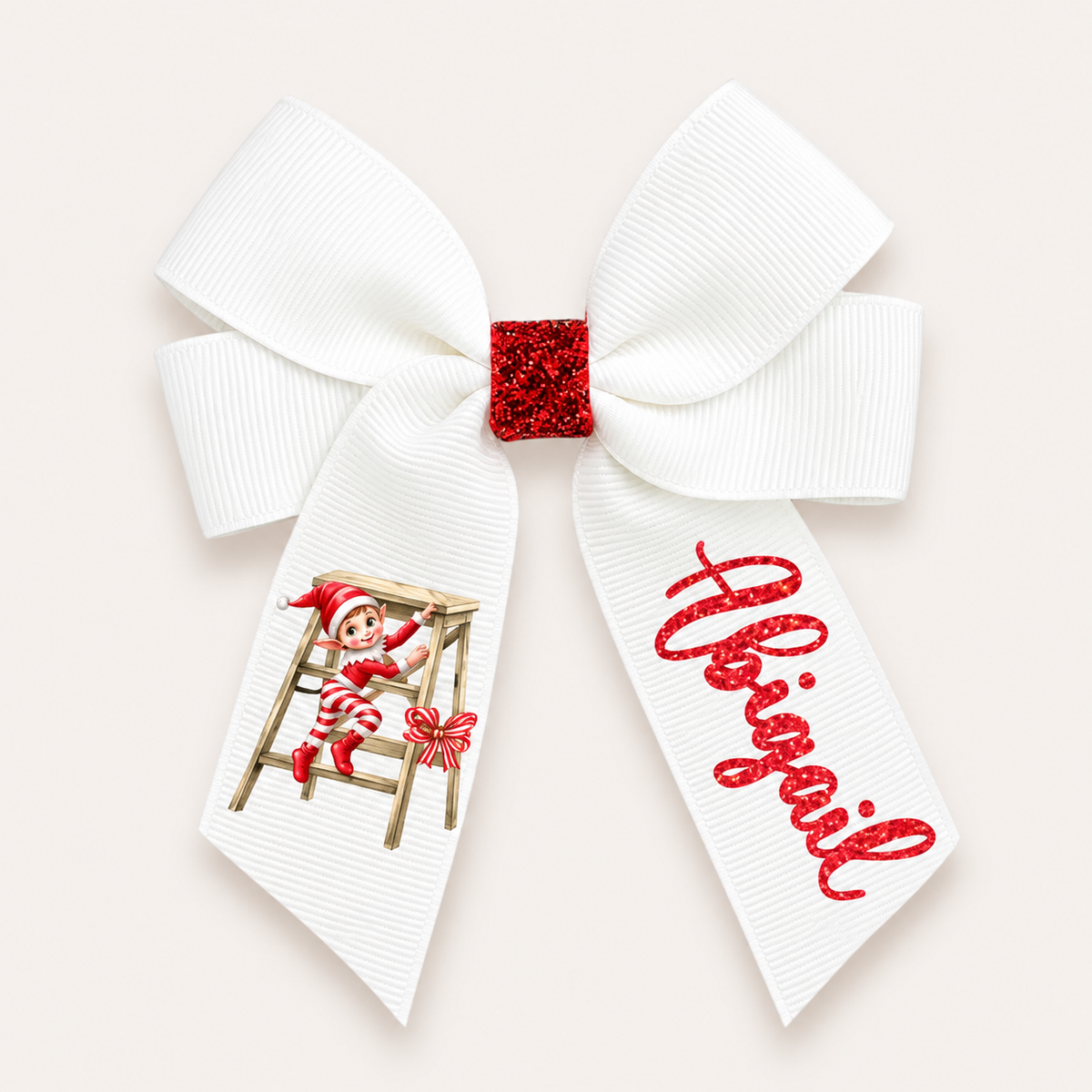 White hair bow with a red glitter centre, an elf on a ladder and red glitter personalised lettering, Grace & Grayson.